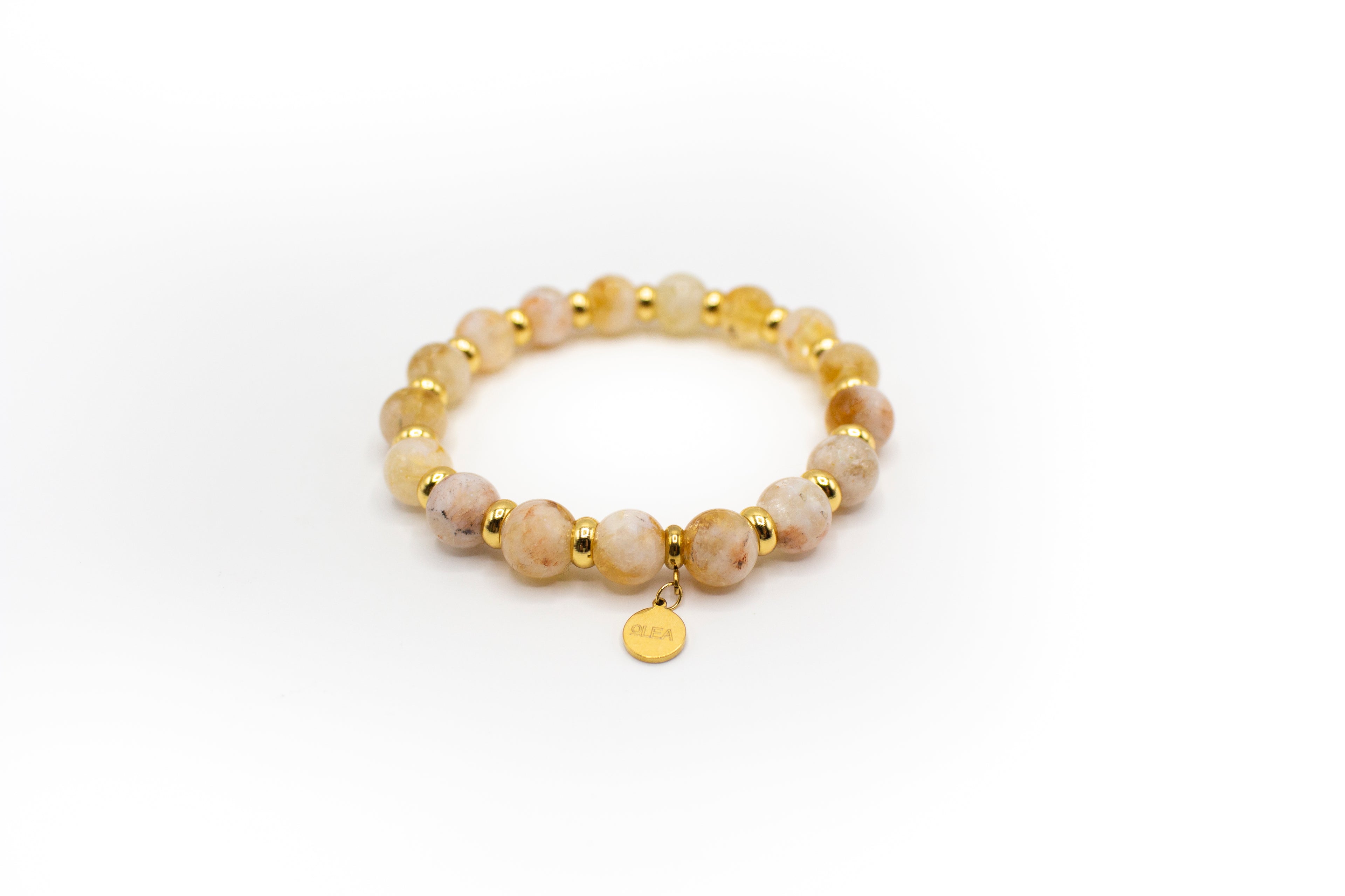 pulsera de acero inoxidable color oro y piedra natural citrino con separadores