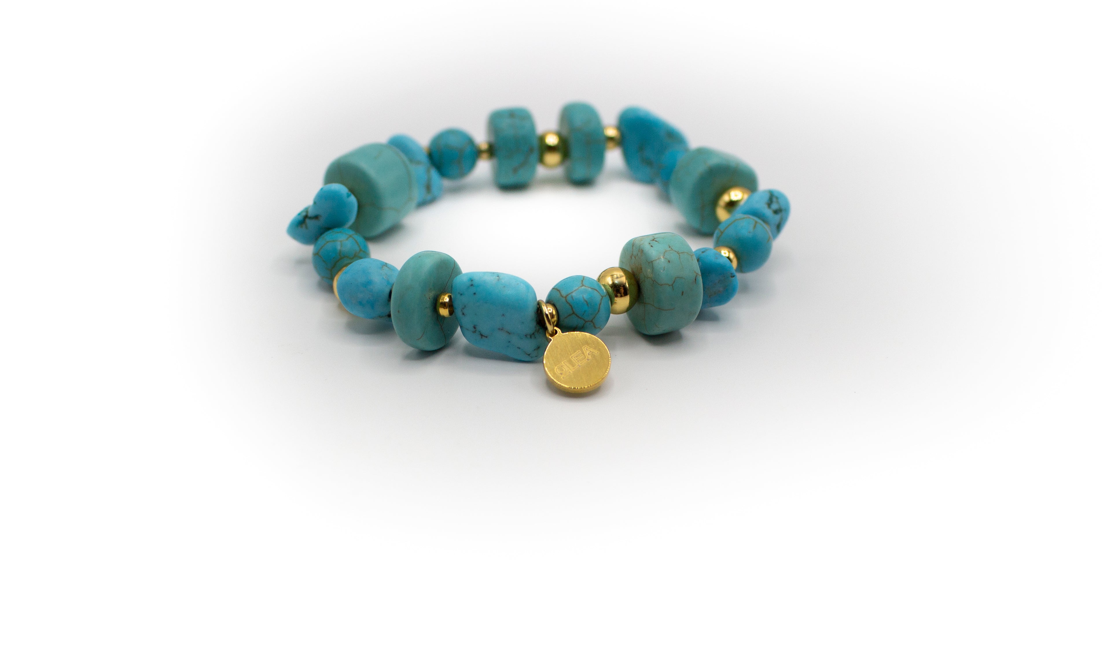 pulsera de piedra natural turquesa con separadores acero inoxidable color oro