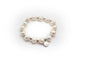 Bracelet composé de perles de culture naturelles et d'entretoises en acier inoxydable couleur argent