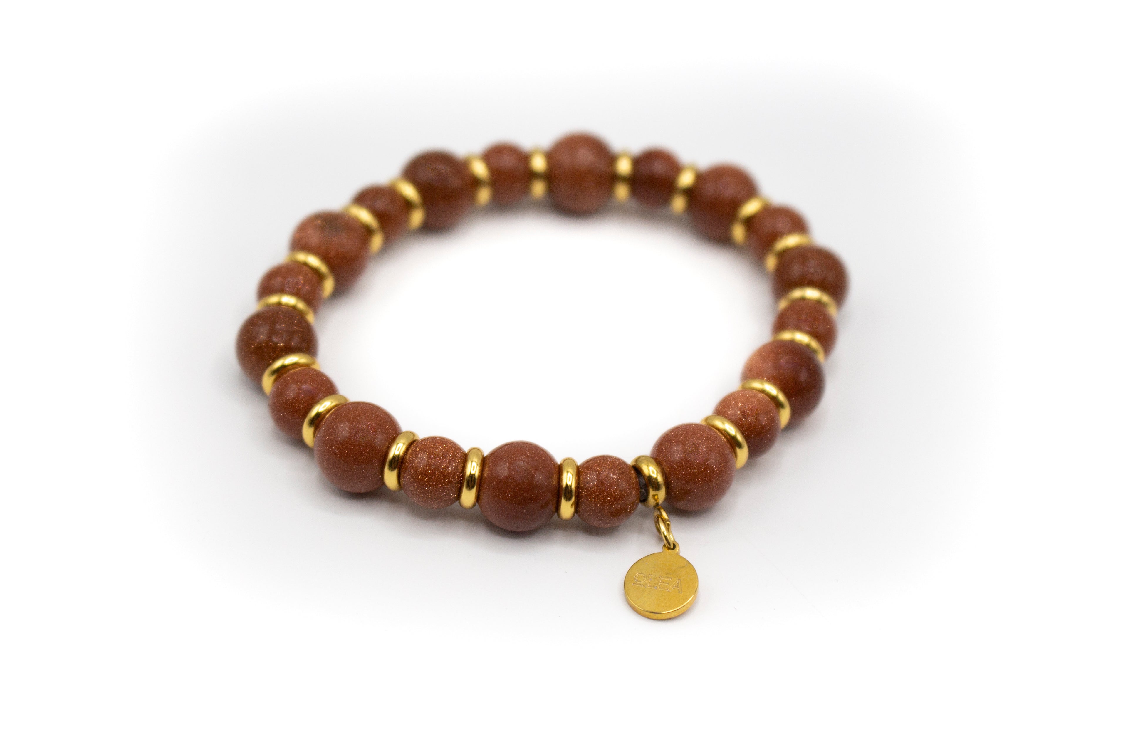 pulsera piedra natural aventurina y separadores de acero bañado en oro