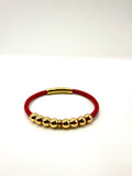 pulsera cuero rojo y acero inoxidable bañado en oro de 14K