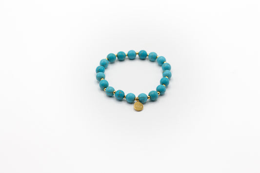 pulsera elástica piedra natural turquesa y separadores de acero inoxidable color oro