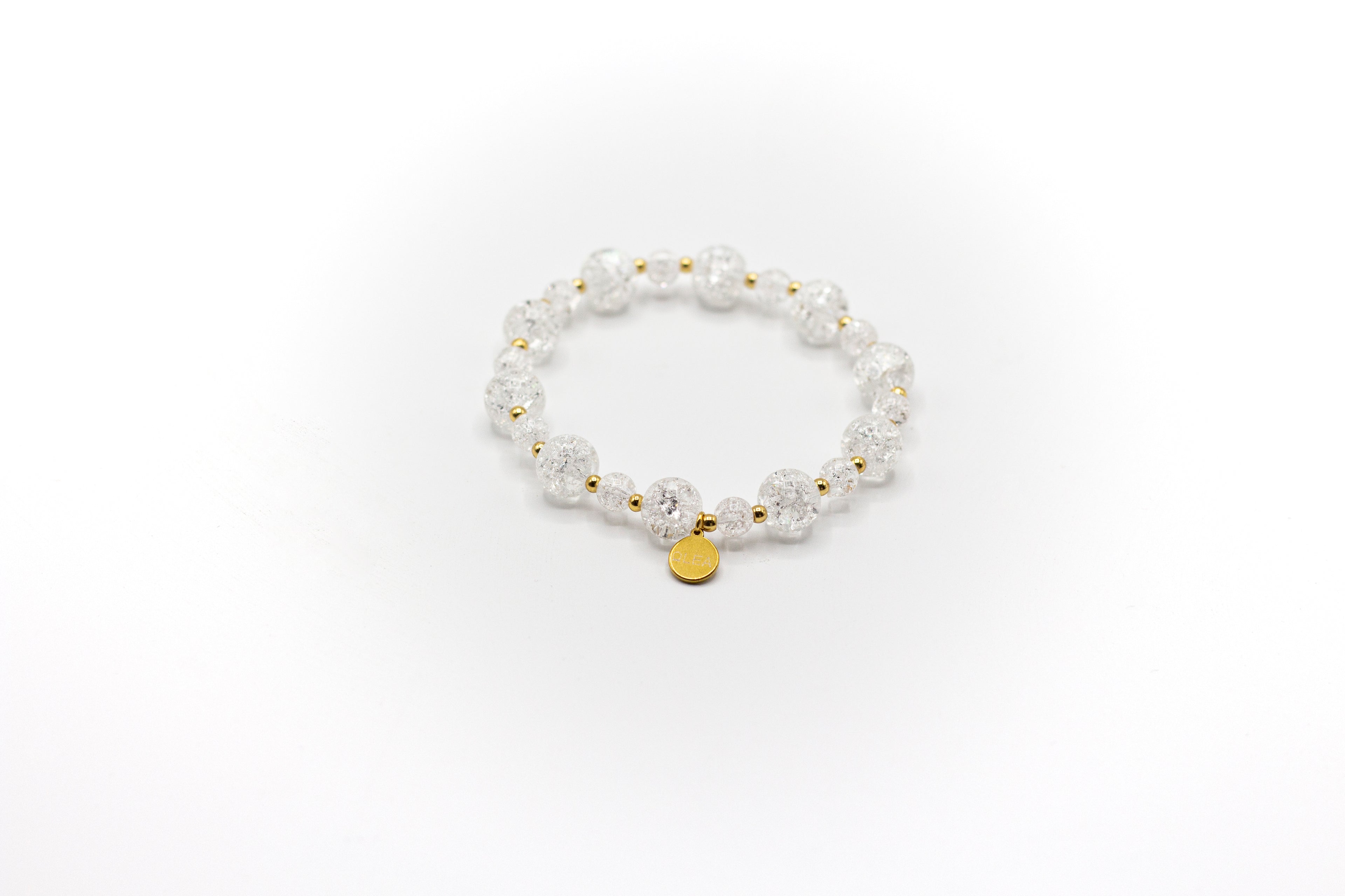 pulsera elástica de piedra natural cuarzo craqueado y acero inoxidable color oro